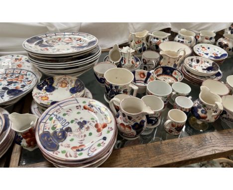 An extensive collection of Gaudy Welsh pottery including jugs, cups and saucers, plates etc 