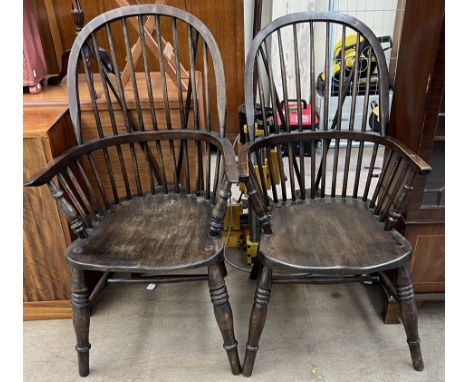 A pair of stick back Windsor chairs on ring turned legs 