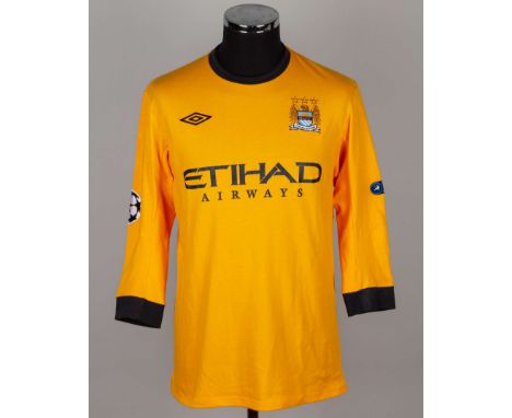 Joe Hart orange No.25 Manchester City v. Bayern Munich match worn goalkeepers shirt, 2011, Umbro, 42 with crew-neck collar an
