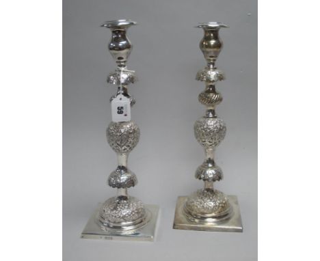 A Pair of Large Decorative Hallmarked Silver Candlesticks, J.L, London 1896, of Middle Eastern style, detailed in relief, wit