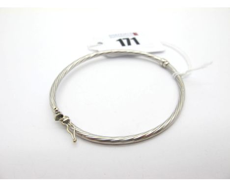 A Modern 9ct White Gold Hinged Bangle, of twisted textured design (sprung hinge) (3.4grams). 