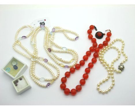 A Modern Long Single Strand Fresh Water Pearl Bead Necklace, of uniform design with polished bead highlights; A Uniform Singl