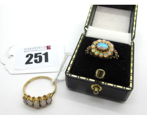 A 9ct Gold Five Stone Opal Ring, oval claw set (finger size P) (1.8grams); A Modern Cluster Dress Ring, of antique style stam