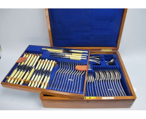 An Elkington &amp; Co Canteen of Plated Cutlery, complete with two sets of ivorine handled knives, the blades stamped "Crusad