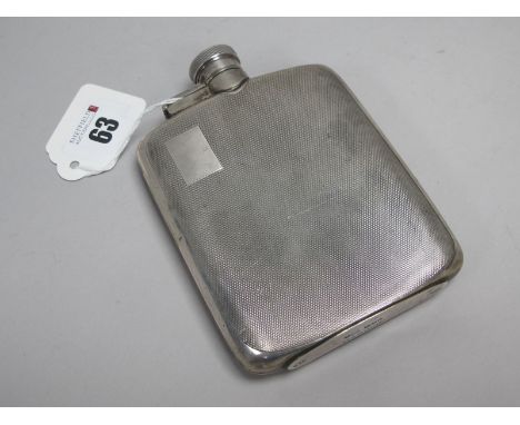 A Hallmarked Silver Hip Flask, JD&amp;S, Sheffield 1947, allover engine turned decoration, with hinged screw top (base stampe