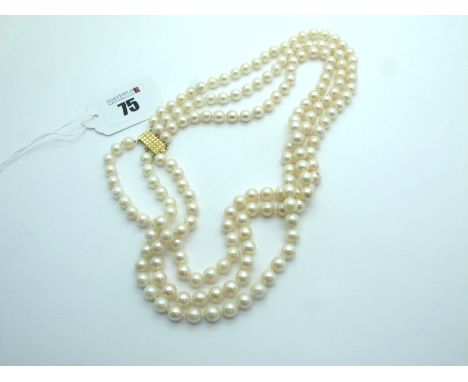 A Three Row Uniform Pearl Bead Choker Necklace, knotted to textured clasp stamped "750", 45cm long. 