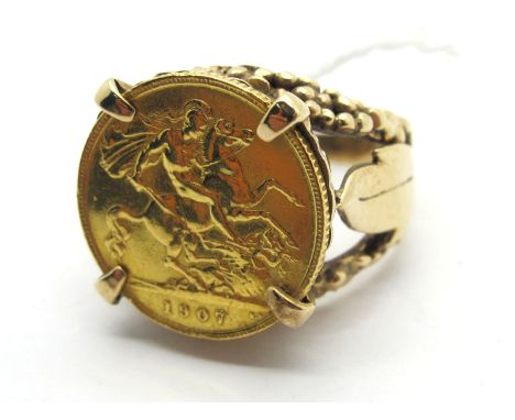 An Edward VII Half Sovereign, 1907, loose(?) set within 9ct gold openwork ring mount (finger size T) (overall weight 11grams)