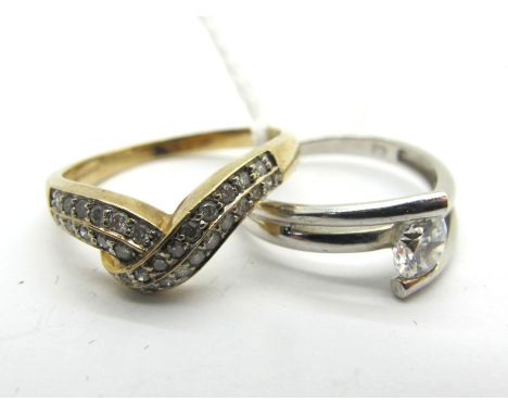 A 9ct Gold Wishbone Ring, with inset highlights, stamped "25PT" (finger size P); A Modern CZ Single Stone Dress Ring, of cros