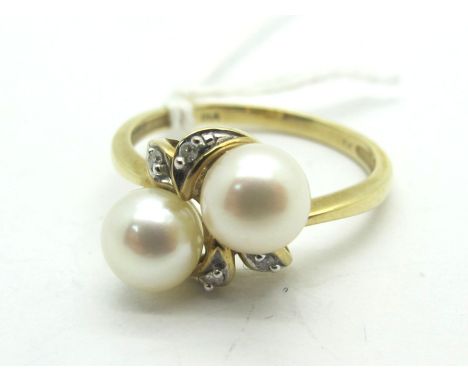 A Modern 9ct Gold Pearl and Diamond Set Dress Ring, of crossover design (finger size N) (2.3grams). 