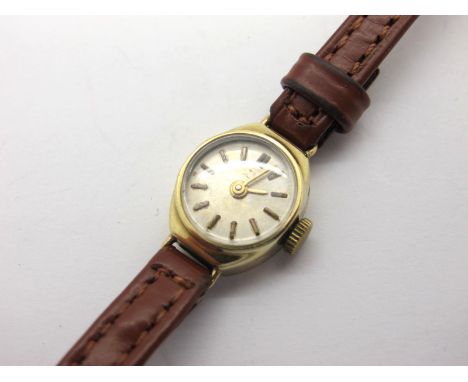 A Vintage Dainty 9ct Gold Cased Ladies Wristwatch, on a strap. 