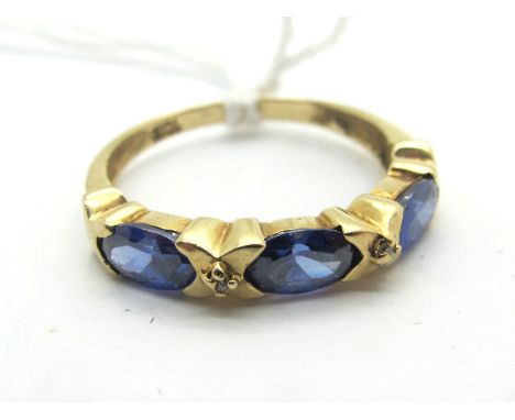 A Diamond Set Band Ring, oval set with diamond highlights, stamped "10k" (finger size O) (1.7grams). 