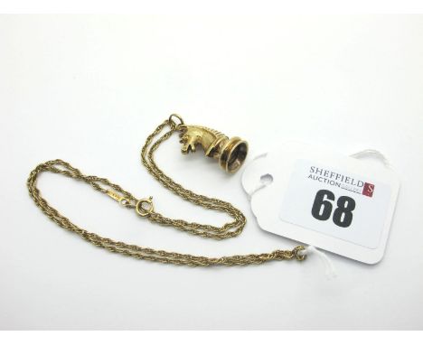 A 9ct Gold Novelty Chess Piece Style Pendant, on a 9ct gold chain (total weight 8.6grams). 