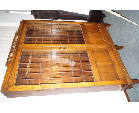 Vintage oak library bookcase of large proportion, leaded glass doors with fielded panels enclosing an array of adjustable she