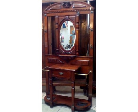 Late Victorian hall stand, inset bevel edged mirror, integral glove draw flanked by two stick stands with original drip pans,