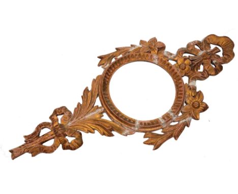 AN 18TH CENTURY STYLE GILTWOOD GIRANDOLE, with circular vacant reserve for a mirror or barometer, carved with ribbons, flower