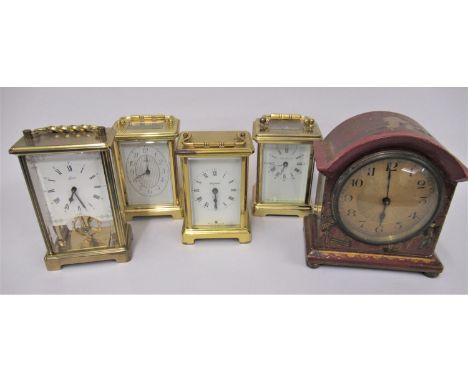 Four various modern brass carriage clocks and a red chinoiserie lacquer cased mantel clock (at fault) 