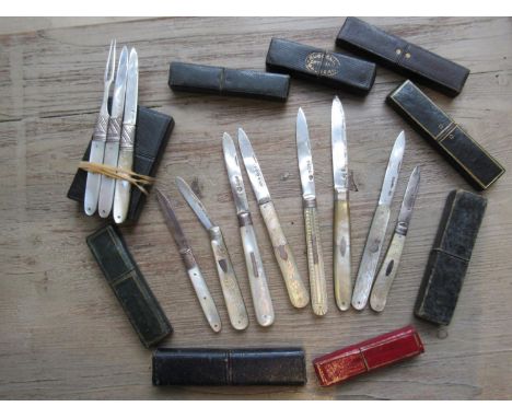 Georgian silver mother of pearl folding fruit knife and fork, together with a similar knife in a single case, together with e