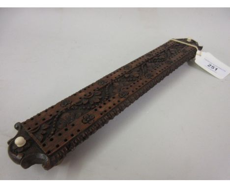 19th Century Black Forest carved wooden cribbage board 
