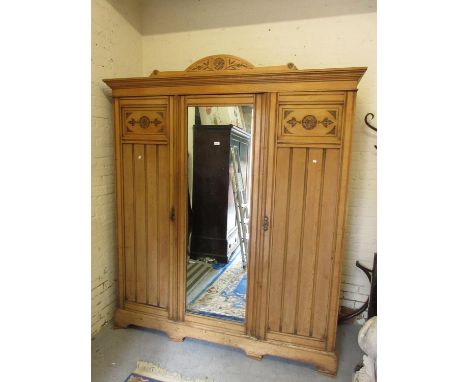 Late 19th Century ash triple section wardrobeCondition is commensurate with age.  Needs a clean and polish but is not damaged