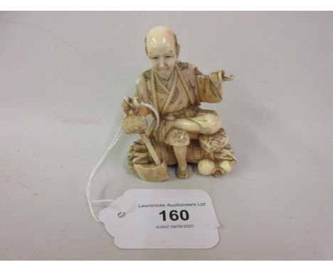 Japanese Meiji period, carved ivory okimono of a seated man holding a walking stick and pipe, red seal mark to base, 3.75ins 