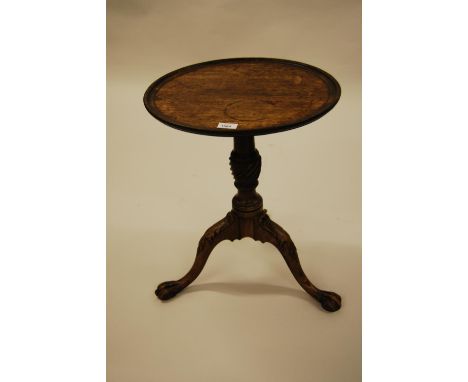 Mahogany pedestal table, the dish top above a wrythen turned column support and carved tripod base with claw and ball feet, 1