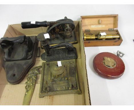 Gilt brass student microscope by H. Hughes and Son, boxed, a cast iron address stamp, a Victorian cast iron stapler, hole pun