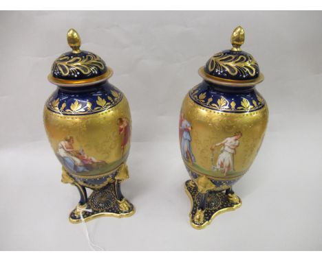 Pair of late 19th or early 20th Century Continental porcelain Vienna style vases with covers, the bodies painted with classic