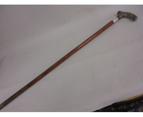 Late 19th or early 20th Century Malacca walking stick with a Chinese silver handle decorated with dragons and character marks