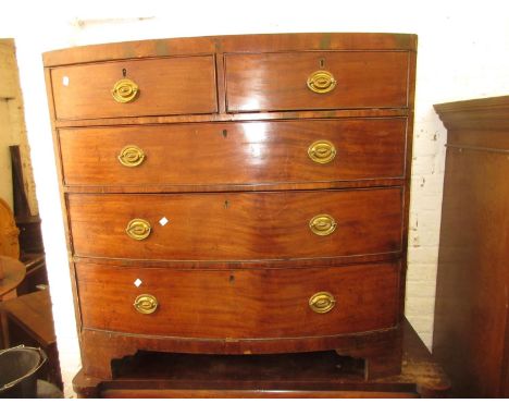 George III mahogany bow front chest of two short and three long drawers with oval brass handles, raised on bracket feetMultip