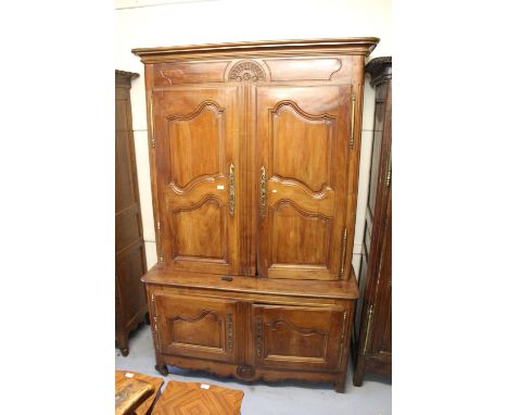 Early 19th Century French cherry wood buffet de corps, the moulded cornice above a carved frieze and four panel doors with br