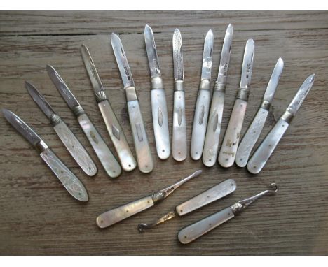 Group of twelve various small silver and mother of pearl folding fruit knives, two similar button hooks and one other item 