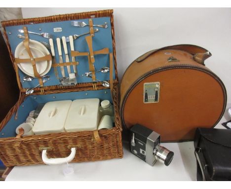 Early to mid 20th Century hat box, a wicker picnic hamper with original contents and a Bell and Howell Sportster cine camera 