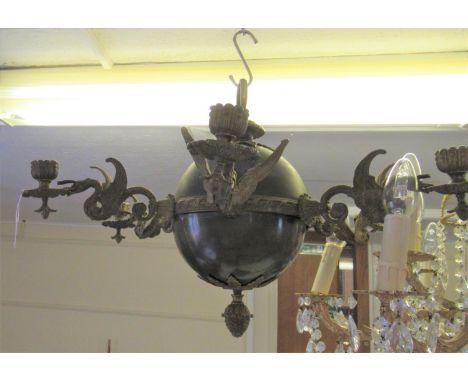 20th Century gilt and dark patinated metal six light electrolier in French Empire style, 24ins diameter approximatelyOne scon