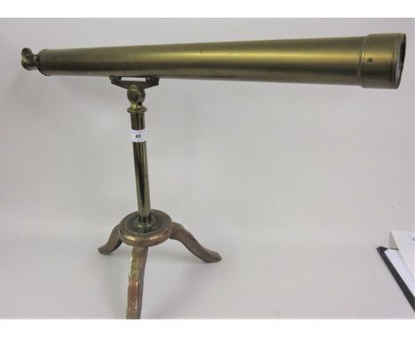 Early 20th Century brass sighting scope mounted on an iron tripod stand 