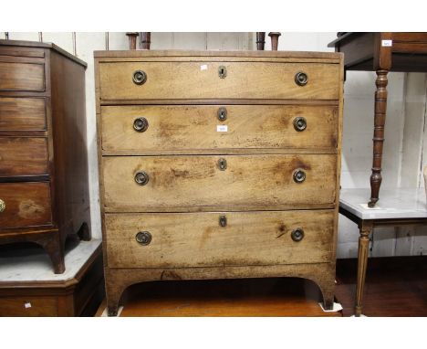 George III mahogany straight front chest of four graduated drawers with brass ring handles raised on bracket feet 