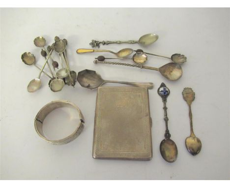 Quantity of various silver and silver plated spoons, silver bangle and a white metal cigarette case 