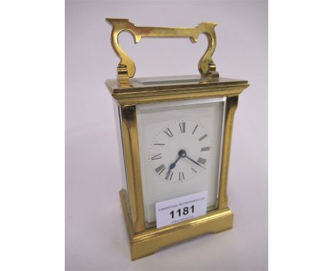 Small mid 20th Century brass cased carriage clock, the enamel dial with Roman numerals, the single train movement signed to t
