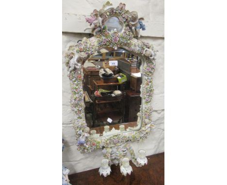 Large late 19th Century Sitzendorf three light girandole, the wide frame profusely decorated with applied flowers and six fig