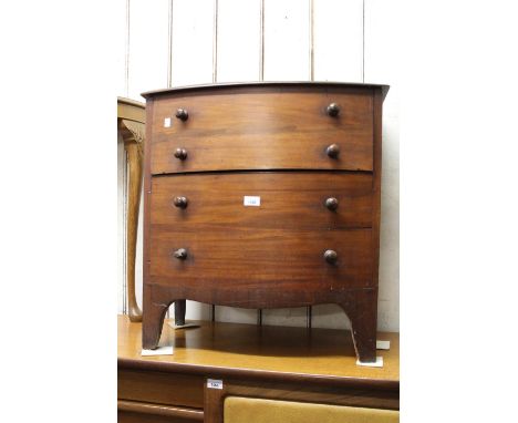 Victorian mahogany bow front commode simulated as a chest of drawers on bracket feet, 26ins wide 