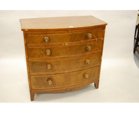 Early 19th Century mahogany crossbanded and line inlaid bow front chest of four graduated drawers with knob handles and brack