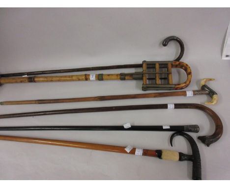 19th Century bamboo shooting stick, two silver mounted walking sticks and three various others, including one with a carved a