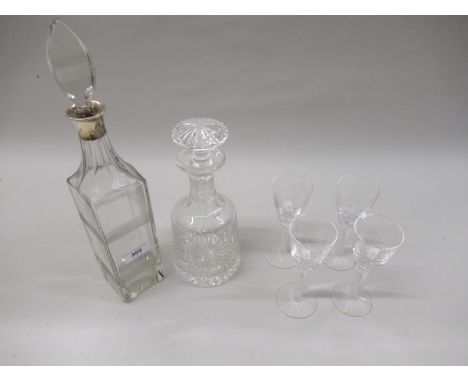 Square silver mounted glass decanter, another glass decanter and a set of four liqueur glasses 