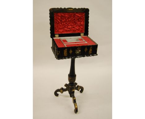Victorian black lacquered papier mache, mother of pearl inlaid and gilt decorated work box, the hinged cover enclosing a fitt