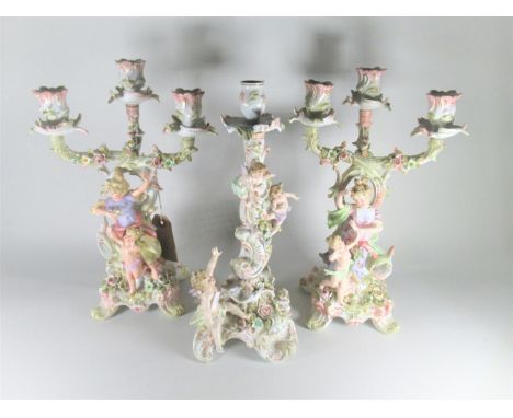 Pair of late 19th Century Sitzendorf three light figural candelabra, 12.25ins high, together with a similar candlestick 