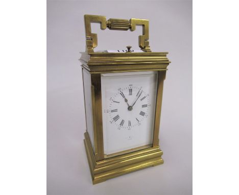 Early 20th Century brass cased carriage clock, the enamel dial with Arabic and Roman numerals, signed Henri Marc, Paris, the 