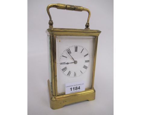 Late 19th or early 20th Century brass cased carriage clock, the enamel dial with Roman numerals the two train movement striki