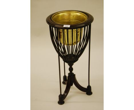 Mahogany basket form jardiniere on tripod stand with brass liner, 25ins high 