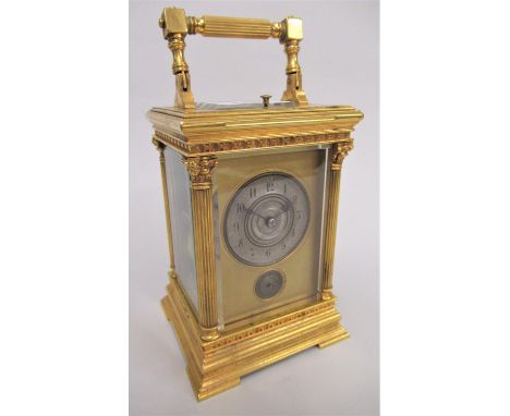 Good quality gilt brass repeater carriage clock with four Corinthian columns, the silvered dial with Arabic numerals and alar
