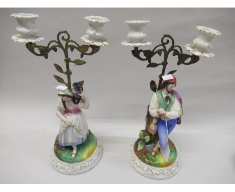 Pair of 19th Century French porcelain, bisque and gilt metal twin light figural candelabra, 13.5ins high 