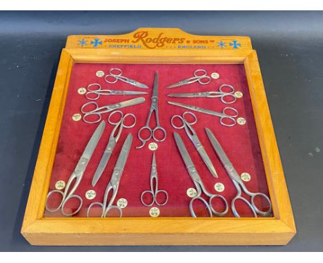 A Joseph Rogers &amp; Sons Ltd of Sheffield dioramah of various pairs of scissors, 15" w x 18" h x 2" d.